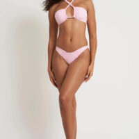 a model in a pink criss-cross bikini